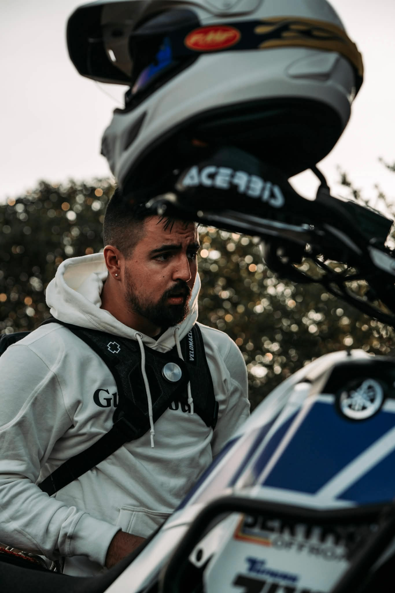 Fastening a matte-black adventure helmet before heading out